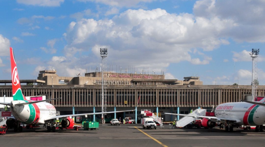 Nairobi, Kenya - August 24, 2008: Kenya Airways aircraft at the terminal building of Jomo Kenyatta International Airport